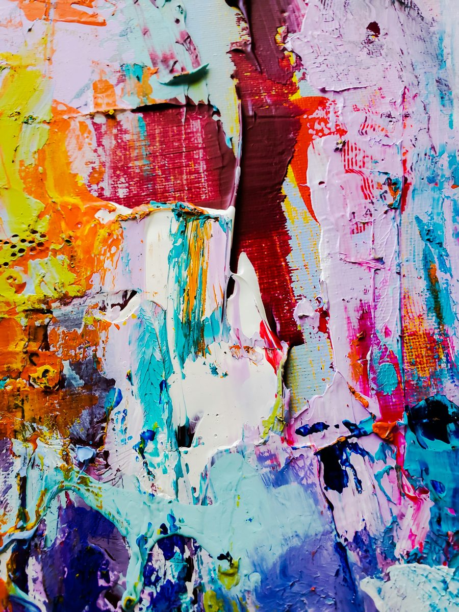 Thick layers of bright, textured paint in orange, plum, turquoise and pink